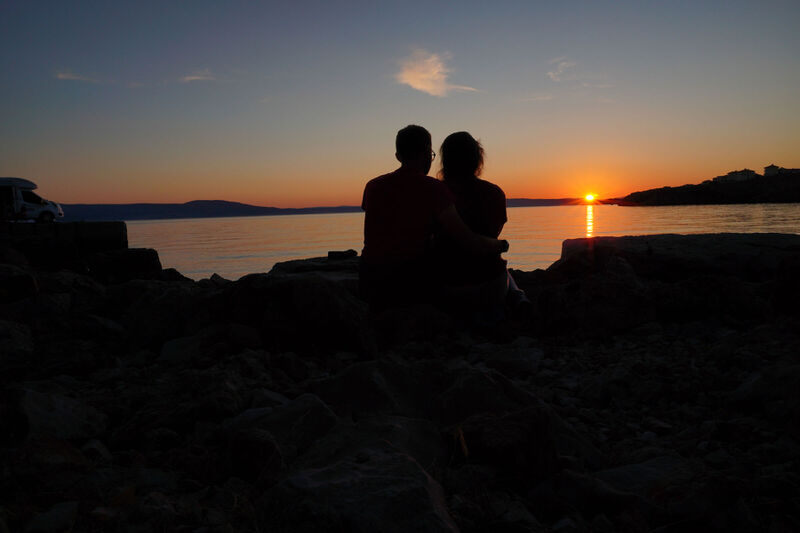 Couple on beach at sunset