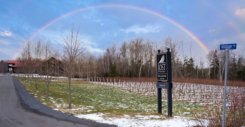 Rainbow over Jost Vineyards Entrance sign to Vintage lane